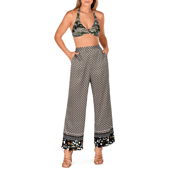 green patterned trousers with contrasting green pattern on hem