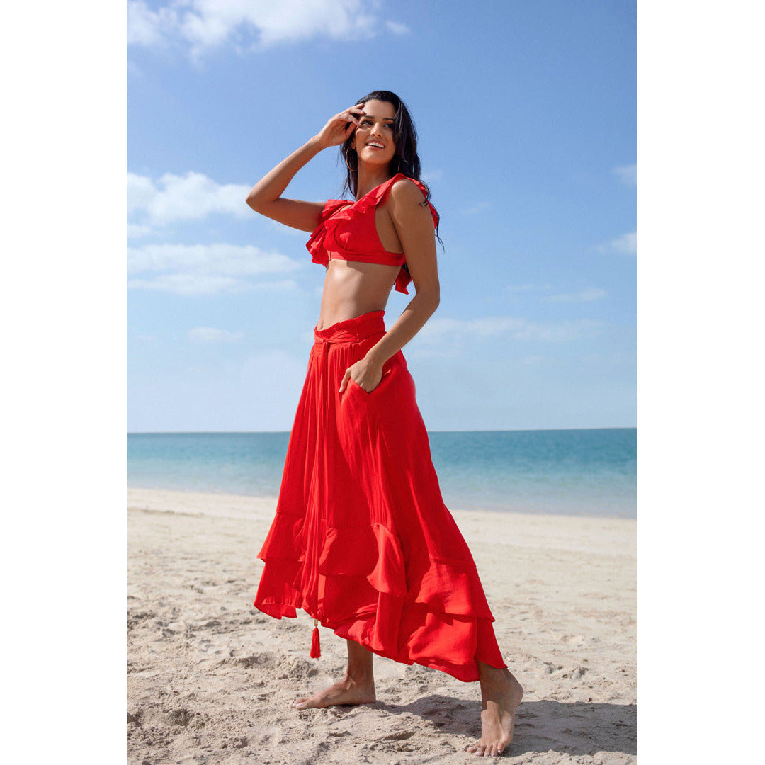 multi use red dress with a higher front, tiered ruffles at hem and sheered waist and can be worn as a skirt or as a dress
