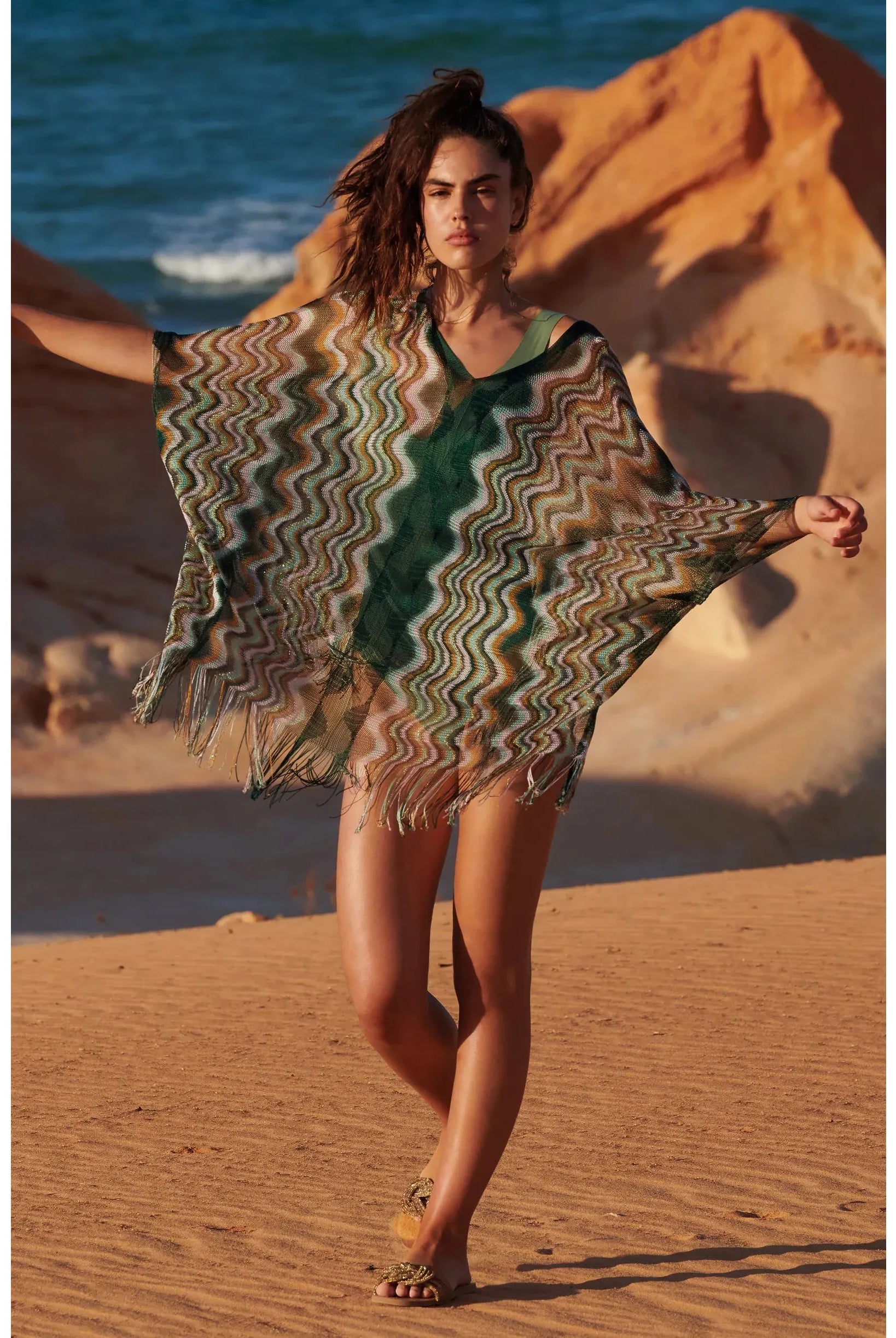 Semi-transparent poncho in thin multi-coloured zig-zag fishnet Fringed at the bottom Front and back V-necklines