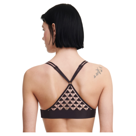 secured on the side under the arm the back is a triangle shape creating a racer back style