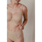 Moulded cup bra made with opaque knit fabric Voile fabric between cups for lightness, lined for support Wide shoulder straps with a padded interior construction for support Sides in veil enhanced with an elastic tri-band Knit fabric on the back with silicone strips inside for support