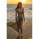 Almond green pareo skirt with gold hoop in the centre. maxi length and open design 